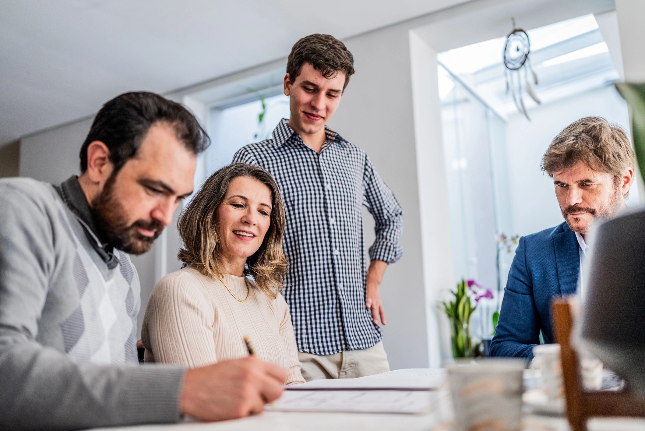 Couple reviewing and signing paperwork together