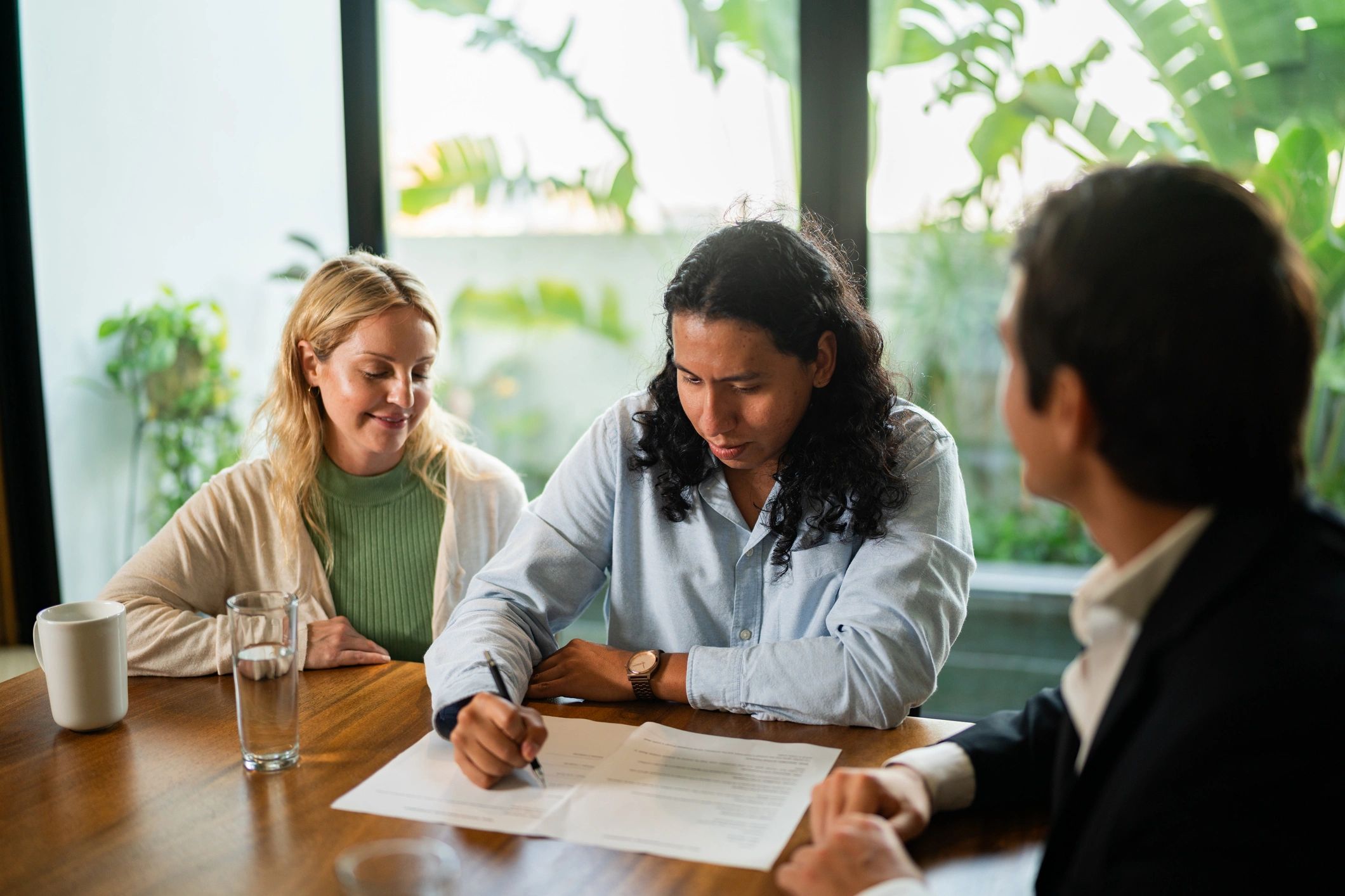 Family reviewing documents together at a table
