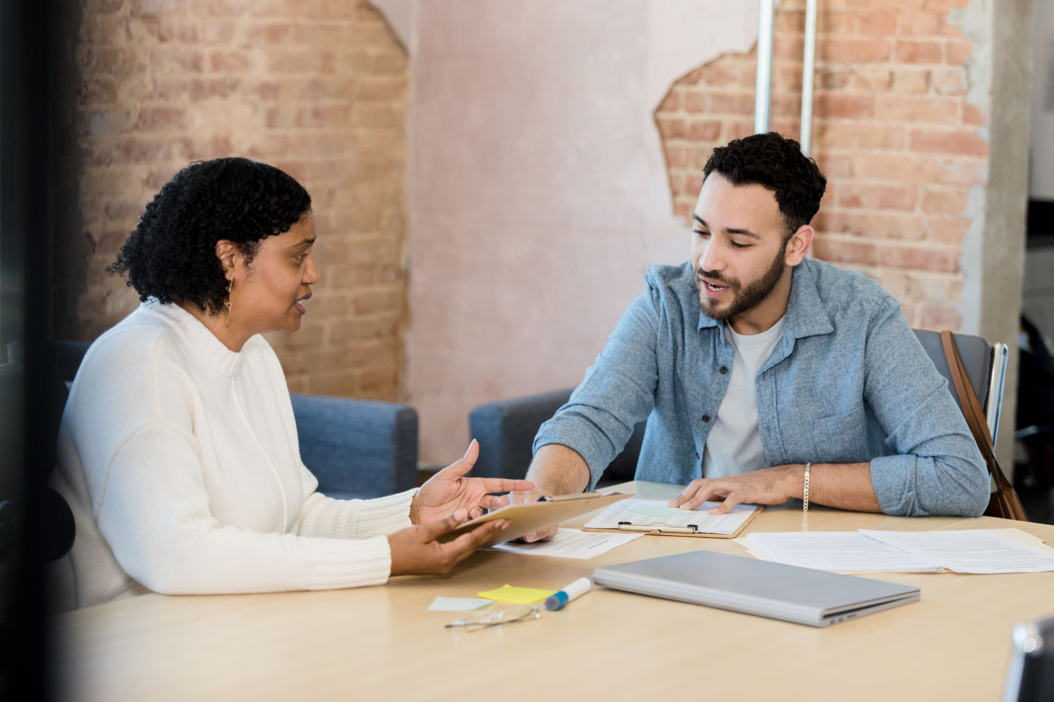 Volunteer assisting a client in an office setting